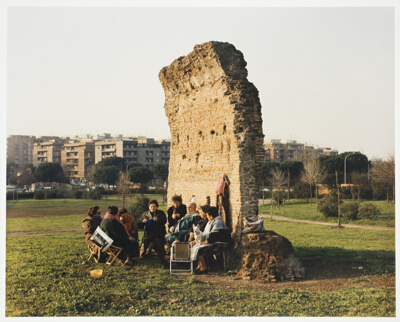 A roman wall surrounded by tourists